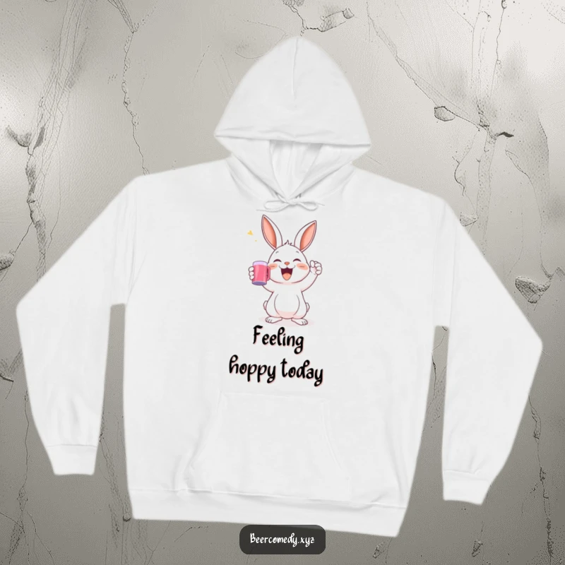A joyful rabbit raising a mug in a toast is printed on a soft and warm hoodie.