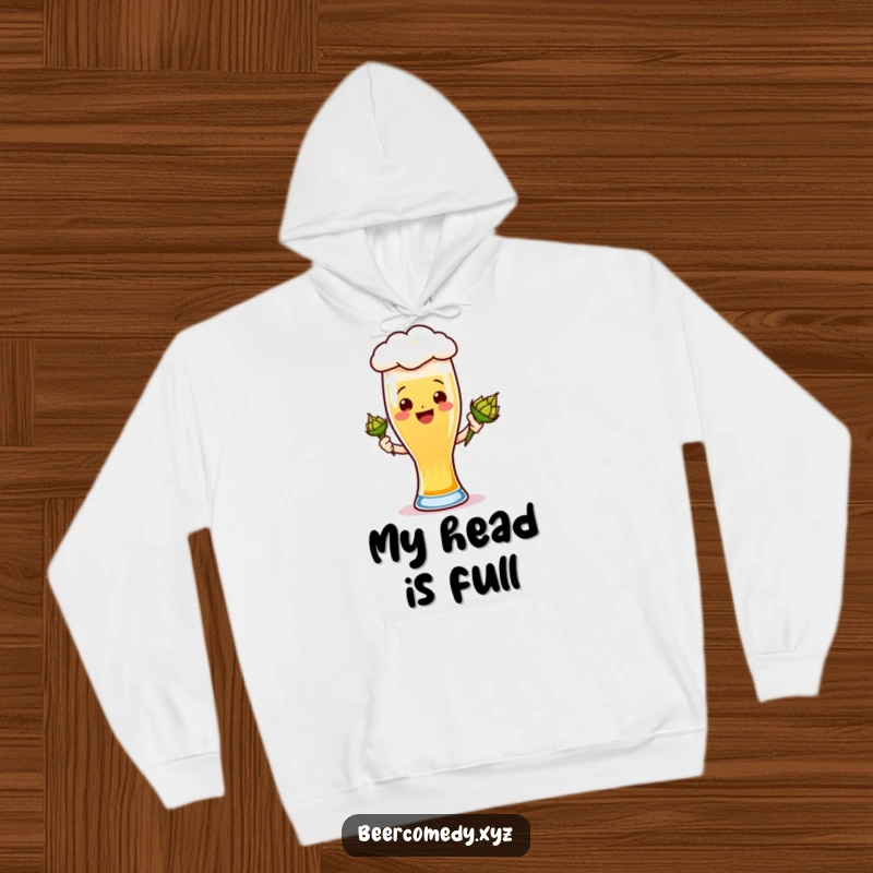 Funny ale glass hoodie depicting a smiling foamy head with a hops cone, offering warmth and humor.