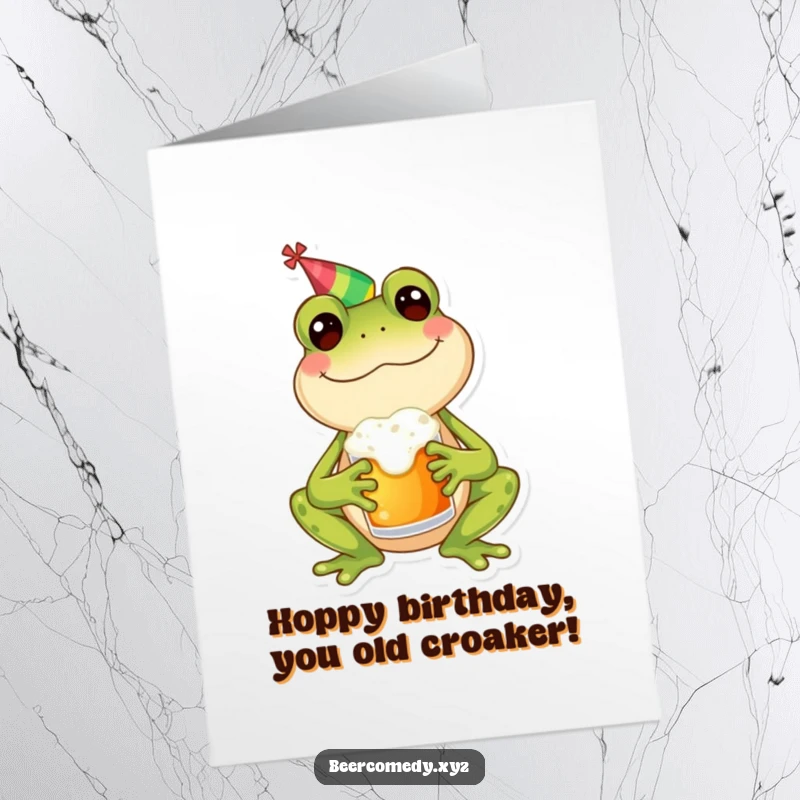 Funny Free Printable Birthday Card: A happy frog in a party hat holding a frothy mug, ready to celebrate with you.